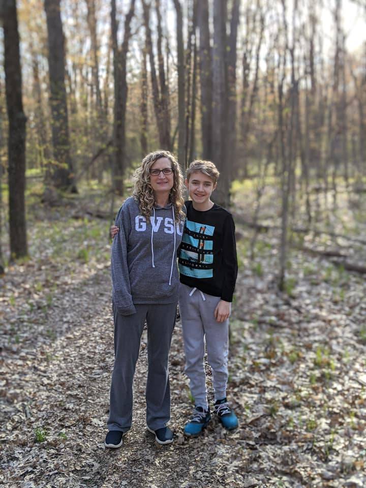 Jennifer Allard and her son on a trail in the Rogue River State Game Area in Cedar Springs, MI